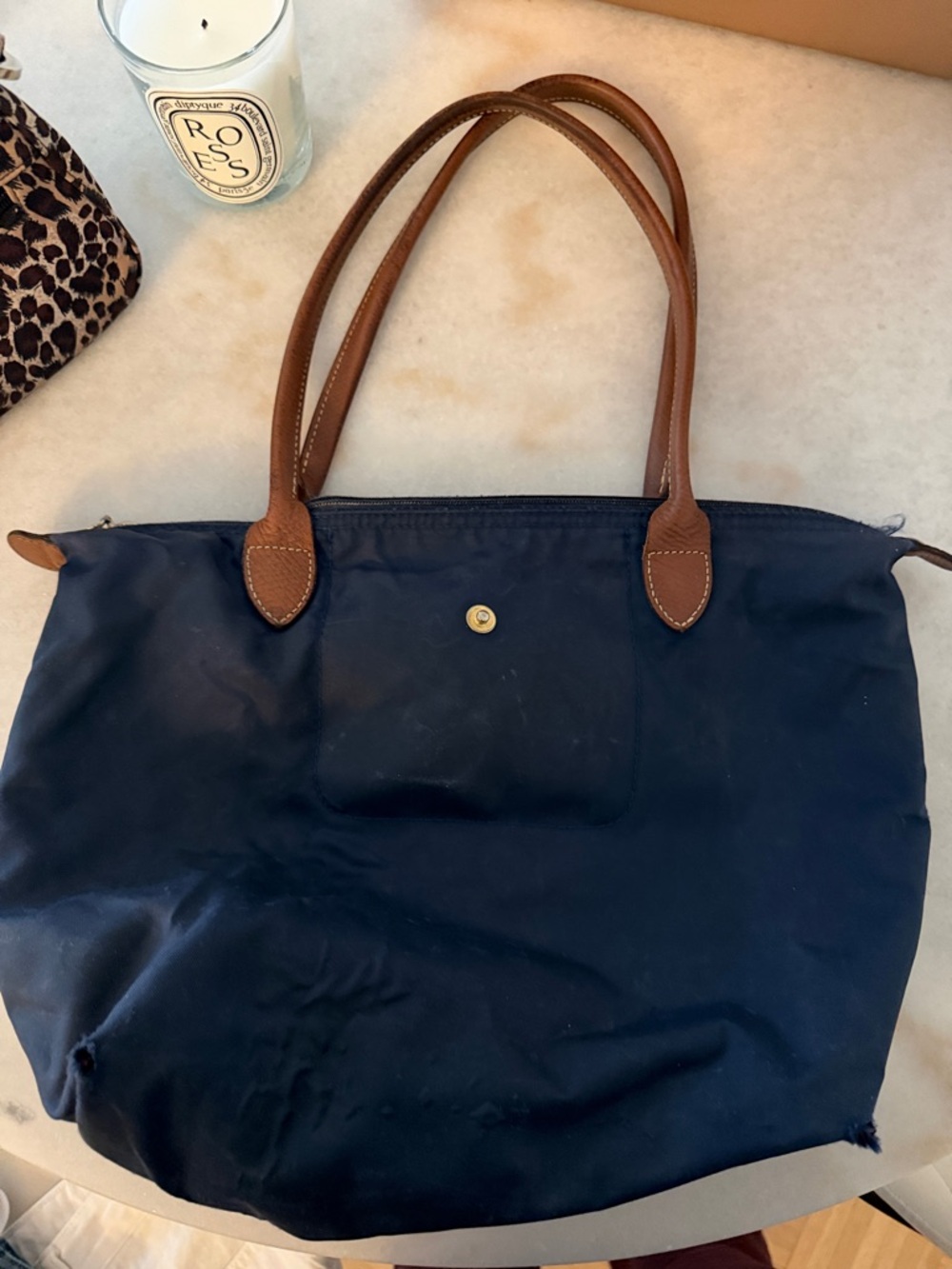 Heavily used Longchamp navy medium size bag